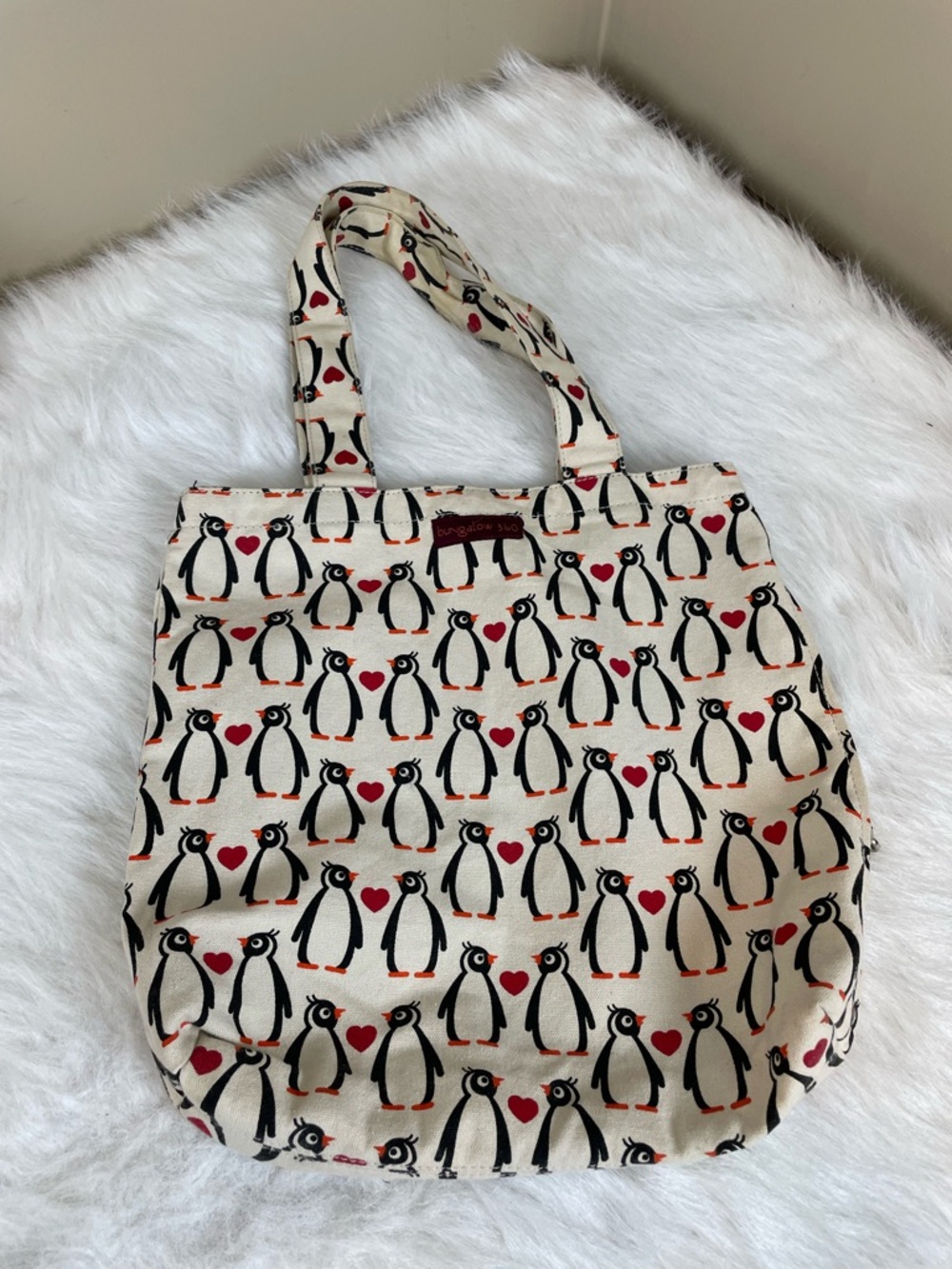 Bungalow 360 Penguin Print Canvas Tote Bag in Cream and Black with Red Accents